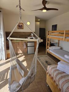 a room with a hammock in a bedroom at פסטרנק אירוח יער אודם in Odem +26 photos