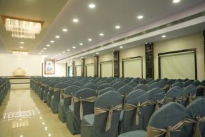 a room full of chairs in a hall at Ravi Convention Centre in Rājānagaram