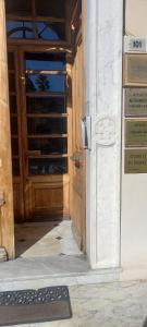an open door with a sign in front of it at Corso Garibaldi mansarda in Sanremo