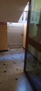 a room with a door and a room with a floor at Corso Garibaldi mansarda in Sanremo