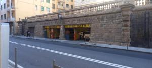 a building on the side of a city street at Corso Garibaldi mansarda in Sanremo +12 photos