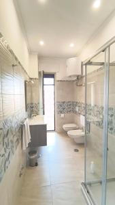 a bathroom with two sinks and two toilets at Casa Michela in Sant'Agnello +21 photos