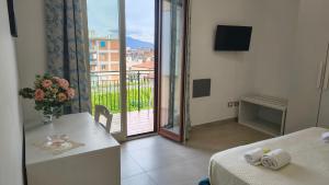 a hotel room with a view of a balcony at Casa Michela in Sant'Agnello