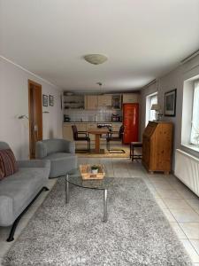 a living room with a couch and a table at Haus Jansen in Korschenbroich