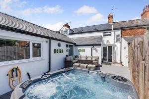 a swimming pool in the backyard of a house at Botanic Cottages in Southport