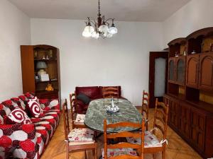 a living room with a table and a couch at La Pennichella in Agerola +42 photos