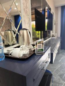 a kitchen counter with a tray with a tea kettle on it at Panorama Resort Oghuz in Oğuz