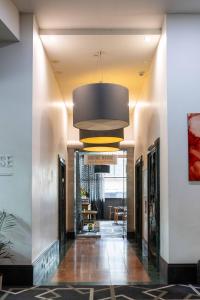 a hallway in a building with a large ceiling at 1 Bedroom Apartment In the heart of Parramatta CBD in Sydney