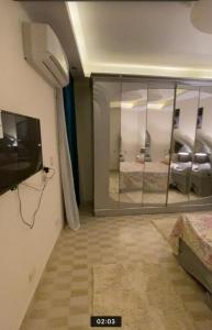a room with a large glass window in a room at horizon sky pyramids in Cairo