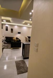 a living room with a couch and a table at horizon sky pyramids in Cairo +3 photos
