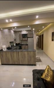 a large kitchen with a counter in a room at horizon sky pyramids in Cairo