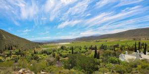 a view of a valley with trees and a house at Montagu Little Sanctuary - Hot Spring Access at reduced price in Montagu