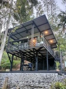 a house with a large deck with a balcony at Ingphai Homestay in Suratthani +15 photos