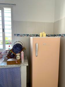 a kitchen with a refrigerator and a counter at Cozy Sousse Studio in Hammam Sousse