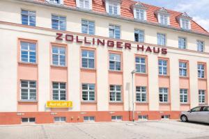 a building with a sign that reads zilker haus at Larooms Merseburg - Apartment CS01 - 3 Zimmer, 7 Betten, 2 Bäder, 2 Parkplätze, Balkon & Aufzug in Merseburg