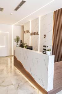 a lobby of a hotel with a marble counter at Hotel Resol 2 in Ksamil +73 photos
