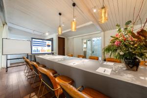 a large meeting room with a long table and chairs at Shenzhen No'6 Garden Villa in Shenzhen