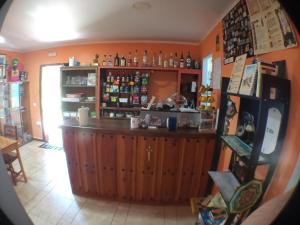 a kitchen with a bar in the middle of a room at Albergue San Bruno in Moratinos