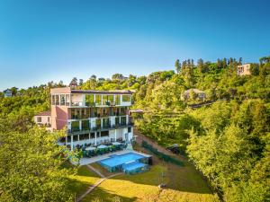 an aerial view of a house with a swimming pool at Gantiadi Holiday - Pool and Houses in Batumi