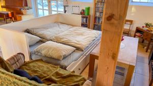 a bed with two pillows on it in a room at SommerHuset in Samsø