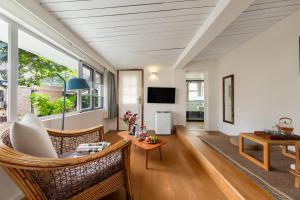 a living room with a couch and a table at Shenzhen No'6 Garden Villa in Shenzhen