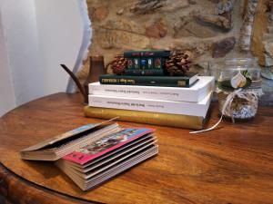 a stack of books sitting on a table at Giagio & Aceto in Larciano