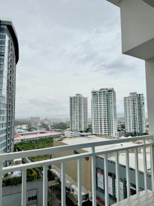 a view of a city from the balcony of a building at Yugen Studio in Davao City