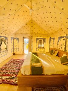 a bedroom with a bed in a tent at Best desert camp in jaisalmer The Velvet Dunes in Sām +69 photos