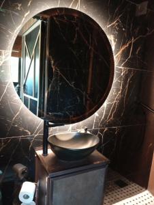 a bathroom with a sink and a mirror at Little paradise in Limassol