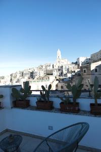 a view of the city from the roof of a building at Lo splendore dei Sassi in Matera +14 photos
