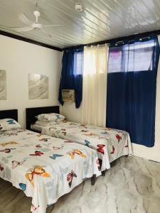 เตียงในห้องที่ Cherry Travellers Inn