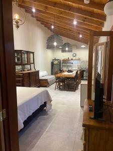 a living room with a bed and a kitchen at Villa Paula II in Ranchos