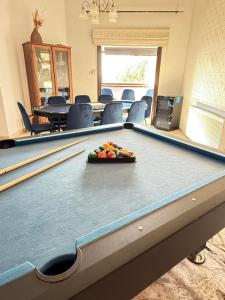 a conference room with a pool table and chairs at Kasparis View Residence in Pano Lefkara