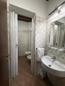 a bathroom with a sink and a toilet at B&B Fonte dei Tufi in Siena