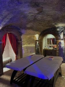 a bedroom with a bed in a room with a cave ceiling at Relais Castrum Boccea in Boccea