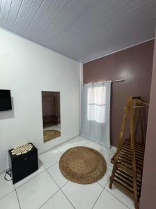 a room with a ceiling and a rug on the floor at Professor Guest House in Santo Amaro