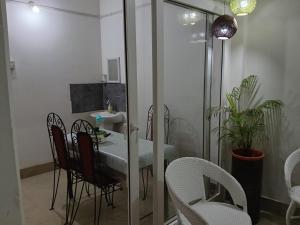 a bathroom with a table and chairs and a sink at Bijoy Villa in Guwahati
