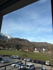 a view of a parking lot with cars parked at Appartement T2 Confort in Albertville +3 photos