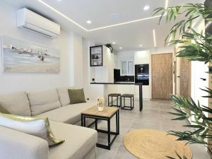 a living room with a couch and a table at Smart Space in La Mata