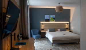 Llit o llits en una habitació de Hotel Wolin