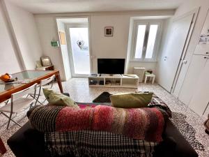 a living room with a couch and a table at Da Ersilia in Cernobbio