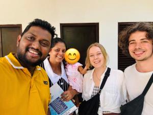 a group of people posing for a picture at Lucky Eagle Nest in Tangalle