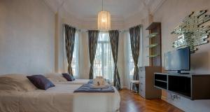 TV a/nebo společenská místnost v ubytování Appartement Vaste Horizon - LRA Cannes + 14 fotografií