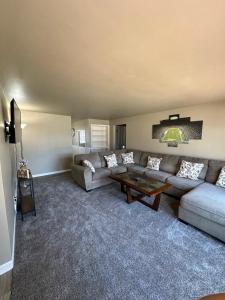 a living room with a couch and a table at Blended Nest in Green Bay