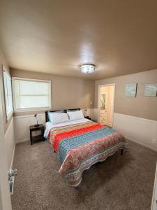 a bedroom with a large bed in a room at Blended Nest in Green Bay