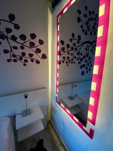 a bathroom with a mirror and two sinks in a room at La Posada de Sofi in Concordia