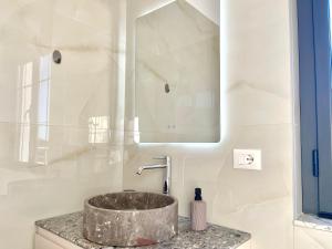 a bathroom with a sink and a mirror at Villa Safira in Durrës +54 photos