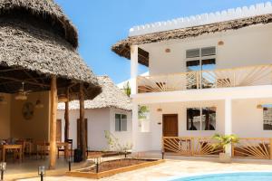 a view of a villa with a swimming pool at OMNYA Nungwi Boutique Hotel in Nungwi