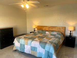 a bedroom with a bed and a ceiling fan at Joel's Place in Lake Wales