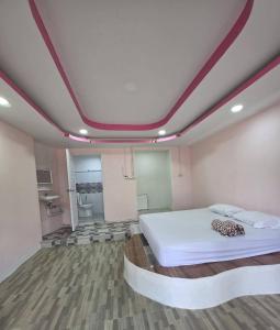 a bedroom with a large bed in a room at Atchanin camping room 2 in Ban Samet